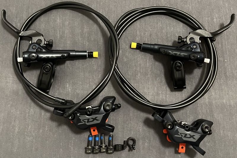 NOVÉ 4-pístkové brzdy Shimano SLX BR-M7120 přední + zadní brzda