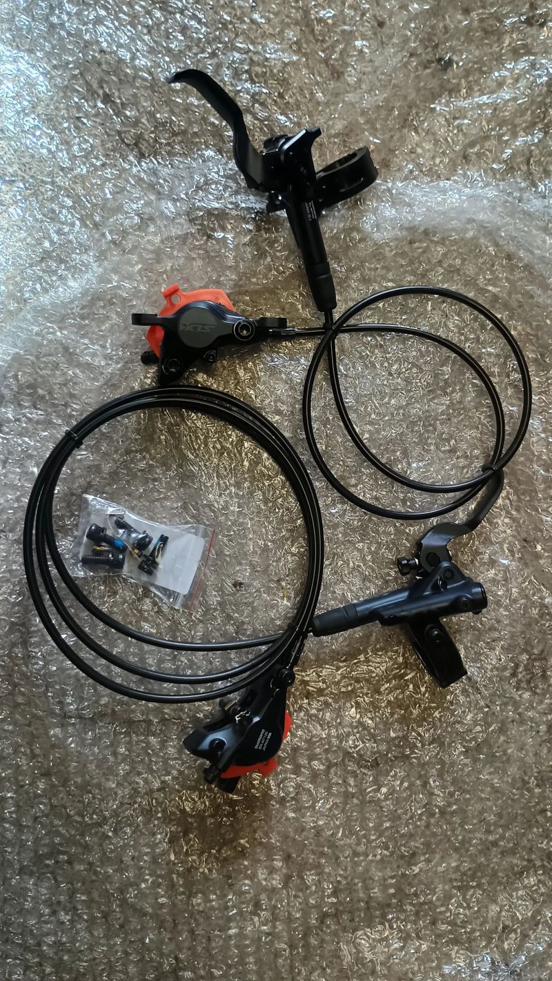 Prodám nové brzdy Shimano SLX, třmeny BR-M7100, páky BL-M7100