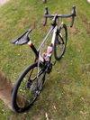Karbonové silniční kolo OLYMPIA 300ST Boost Carbon Disc Sram RIVAL AXS 125 Years Aniversary