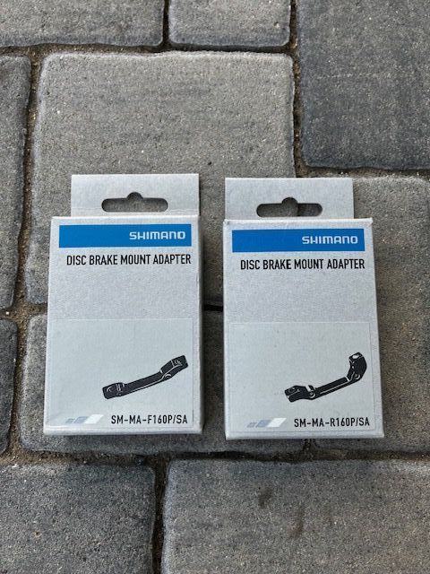 Brzdový kotouč 160 Shimano DEORE SM-RT76 + adaptéry pro brzdové kotouče. (přední, zadní) SM-MA-F160P