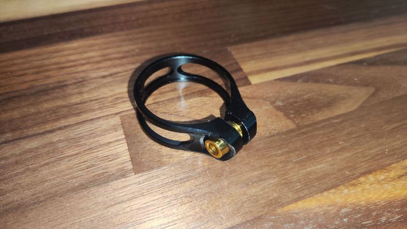 Objíma 31.6mm AL + titanový šroub