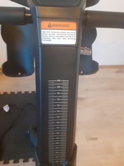 Cyklotrenažér z Decathlonu s účtenkou o zakoupení.