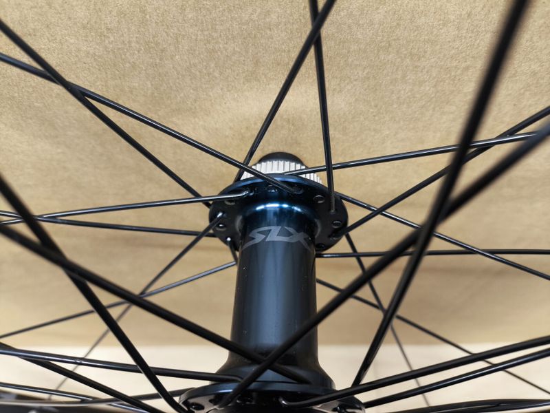 zapletená kola Rodi náboje Shimano SLX