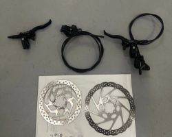 Prodám hydraulické kotoučové brzdy Shimano, páčka MT4100, třmen MT410.