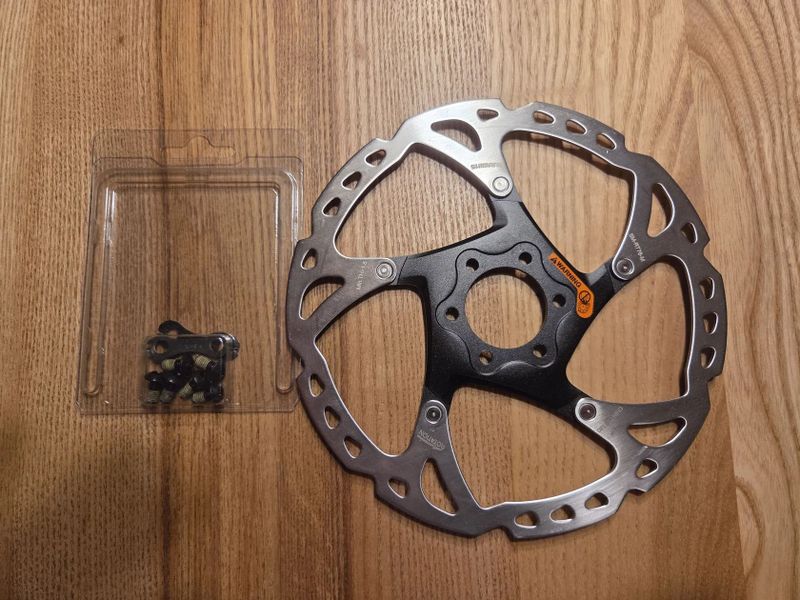 Prodám nejetý brzdový kotouč Shimano XT 180mm