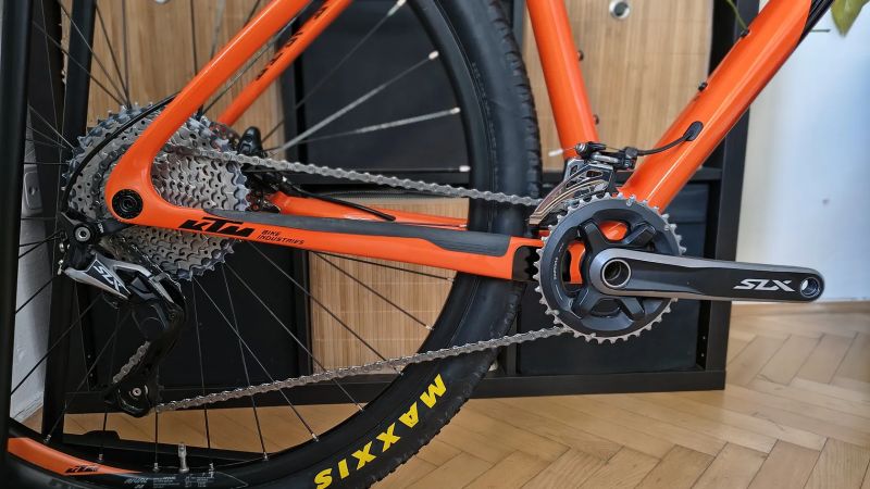 KTM Myroon carbon Orange / vel.M / Shimano SLX / teleskop