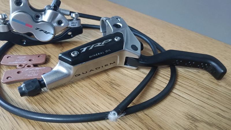 brzda přední levá TRP Quadiem G-Spec NOVÉ