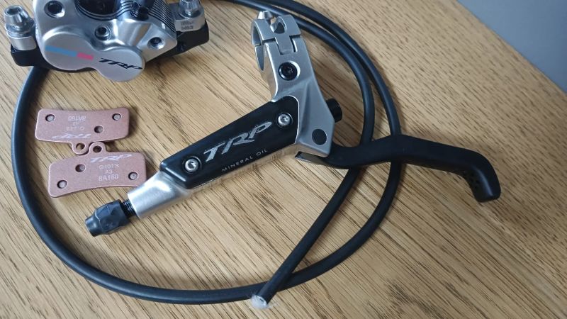 brzda přední levá TRP Quadiem G-Spec NOVÉ