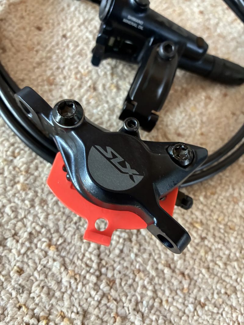 Shimano SLX 2-piston přední a zadní brzda + třmeny