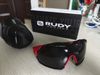 Rudy Project Cutline Fire Red za 1500 Kč a dále brýle Van Rysel