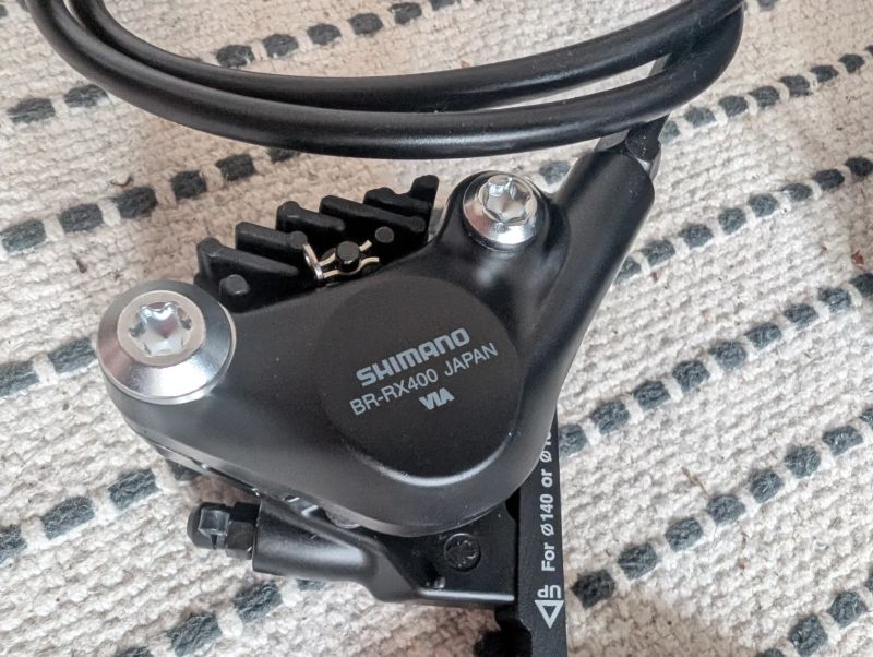 Shimano GRX ST-RX610 / BR-RX400 1x12. Set pravá + levá páka + třmeny. 
