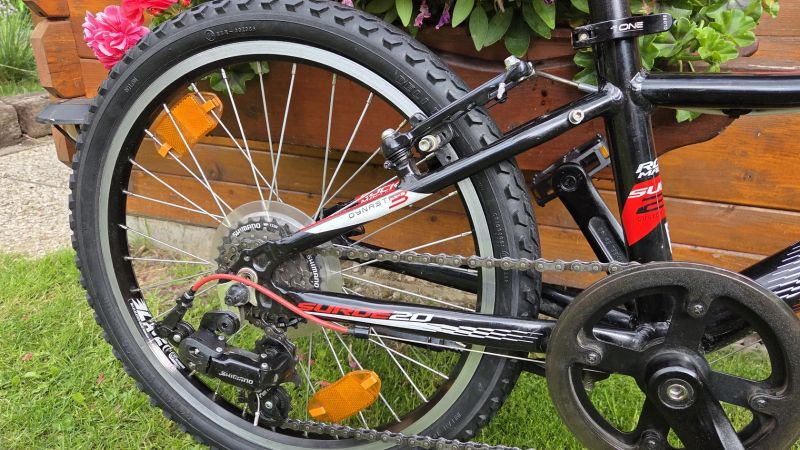 Dětské kolo 20" Rock Machine Surge 4-9let postava 100-135cm 